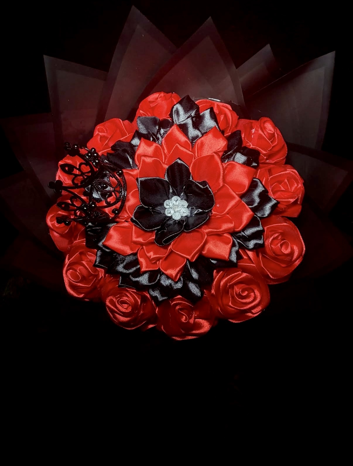 Red and black satin rose bouquet with a black tiara accent